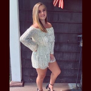 Sequenced off the shoulder long sleeve romper.